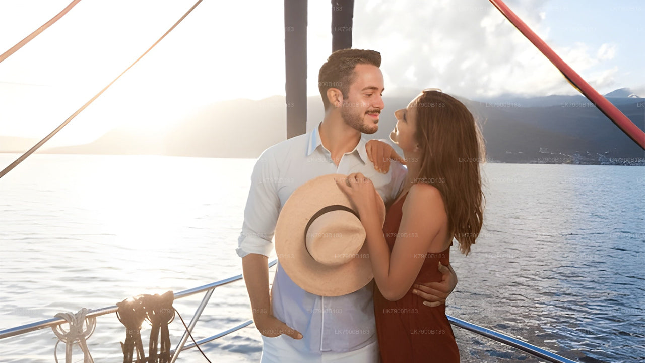 Couple on a sailboat with a scenic background